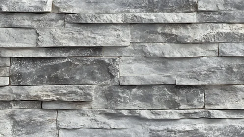 Modern stacked stone wall with textured gray slate finish.