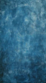 Textured blue abstract background with mottled surface pattern.