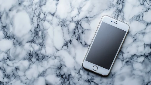 Calm silver smartphone resting on cool marble surface.
