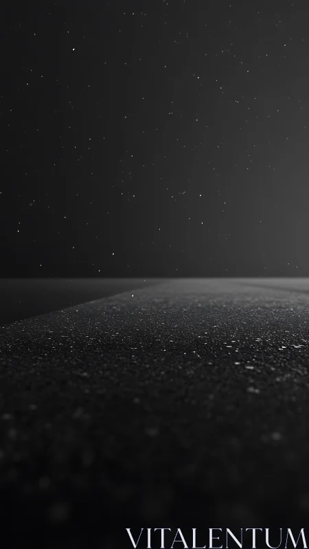 Nocturnal asphalt horizon under sparse reflective rainfall.