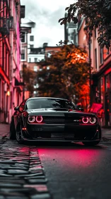 Sleek black muscle car glows in neon lit urban street