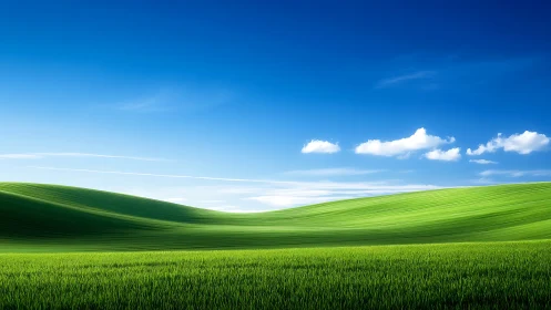 Sunlit green hills curve under deep blue midday sky