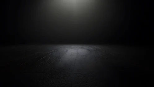 Single overhead spotlight defines textured stage floor plane