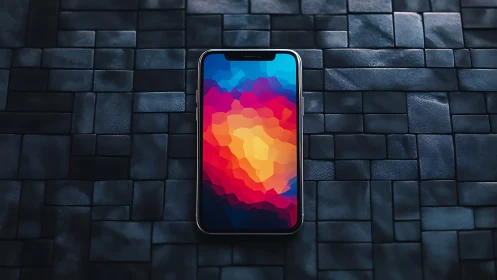 Smartphone displaying abstract gradient wallpaper on textured background