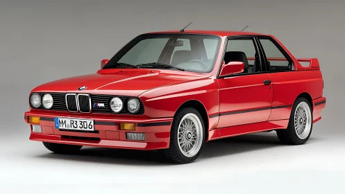Classic red BMW coupe in controlled studio lighting profile.