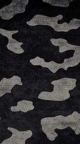 Monochrome camouflage textile pattern uses coarse woven texture
