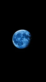 Blue moon glows against deep black cosmic void in silence.