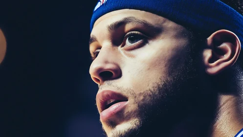 Closeup of focused basketball player wearing blue headband