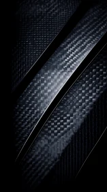 Carbon fiber ribbons carve sleek paths through midnight light.