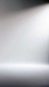 Soft gradient light beam cuts across minimal grey field