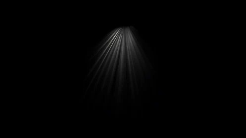 Monodirectional volumetric light beam over deep black field.