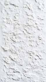 White plaster wall with rough textured surface detail.