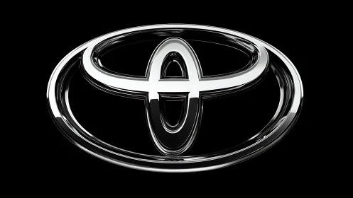 Chromed triple-ellipse automotive emblem under studio keylight.