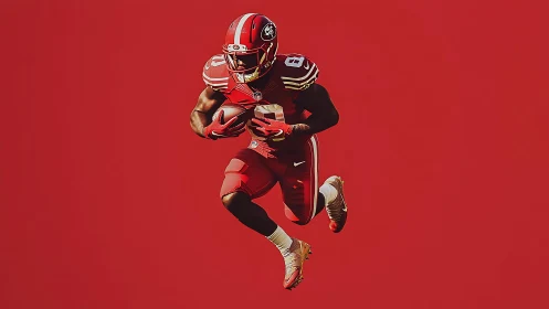 High contrast NFL running back isolated on flat red field