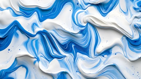 Blue and white fluid paint waves in abstract motion.