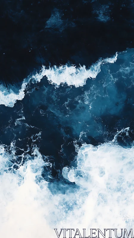 Restless ocean waves roll in deep navy and glowing foam