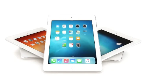 Three White iPads Display Vibrant Home Screens Side by Side.