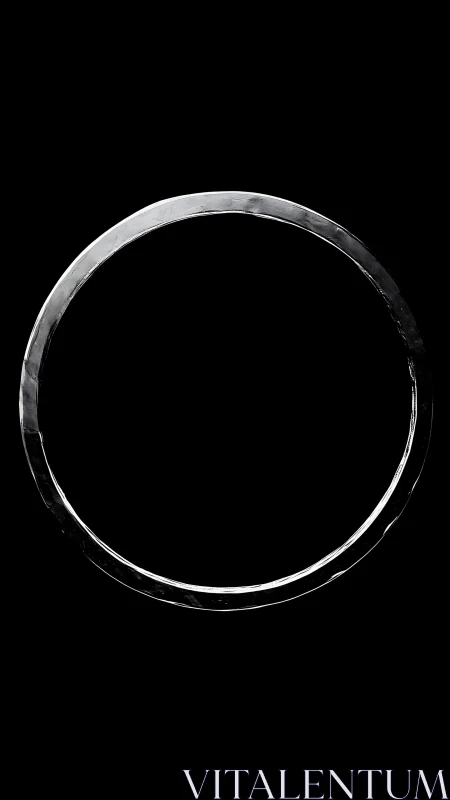 Specular metal ring silhouette under high-contrast isolation.