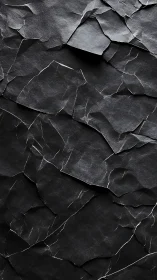 Layered black torn-paper relief with angular fracture lines.