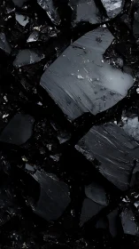 Midnight obsidian shards with glassy, moonlit reflections.