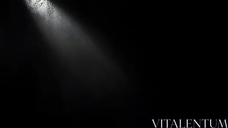 Single bright light beam cutting through deep darkness.