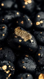 Midnight river stones kissed by scattered molten gold flecks.