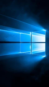 Luminous blue window logo emits sharp beams into darkness