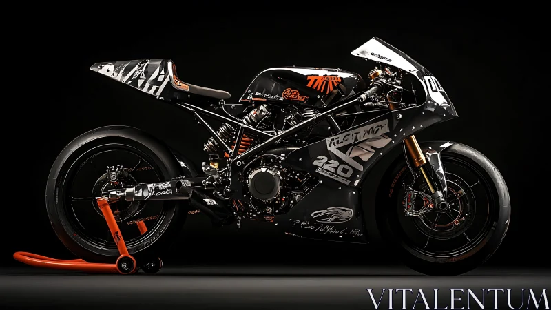 Track-prepped racing motorcycle with graphic livery on black.