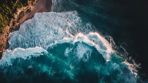 Aerial wave crest dynamics against sunlit coastal cliff