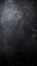 Dark textured concrete surface with subtle worn details.