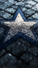 Blue outlined stone star in wet cobblestone pavement street.