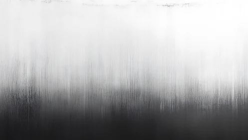 Soft monochrome gradient drifts gently from dark to light