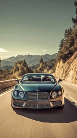 Luxury coupe powers along sunlit mountain highway at speed