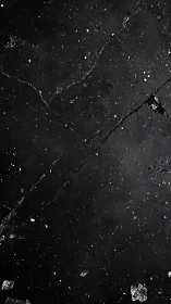 Dark cracked stone surface with scattered debris texture.