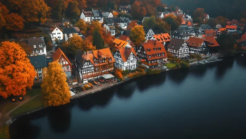 Lakeside autumn village glowing with cozy riverside charm.