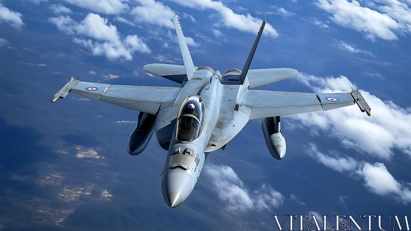 Modern fighter jet cuts through bright blue sky in flight