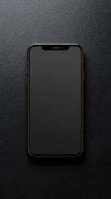 Modern smartphone displaying dark screen against textured gray background surface