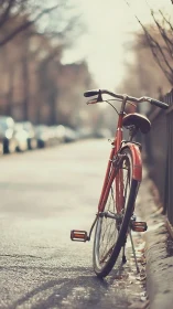 Red Bicycle Parked on Quiet City Street.
