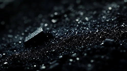 Macro view isolates glittering granular surface in low light