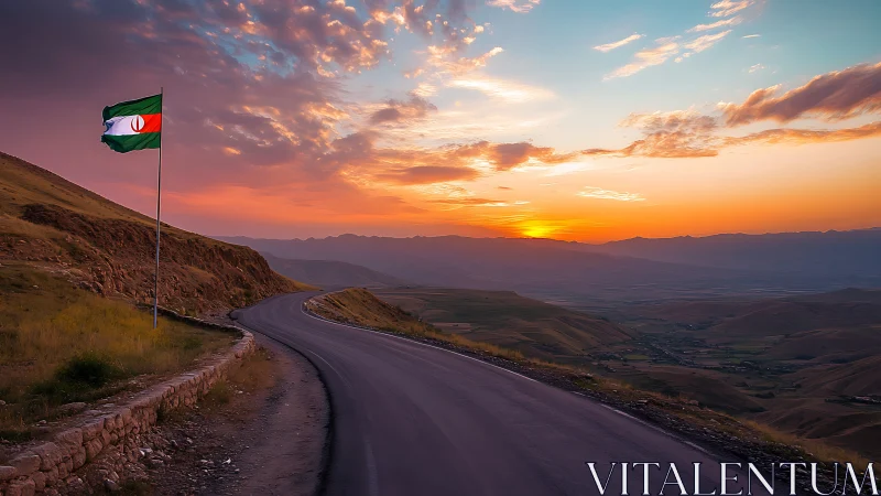 Winding mountain road greeting a peaceful, golden sunset sky.