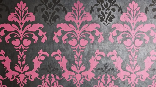 Pink and black damask pattern on textured gray surface.
