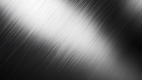 Brushed metallic surface captures diagonal light gradients cleanly