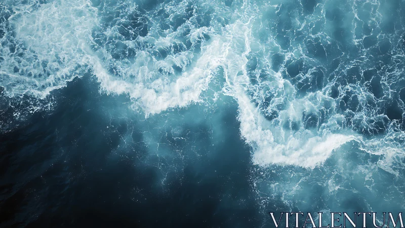 Aerial ocean waves crash in layered turquoise foam.