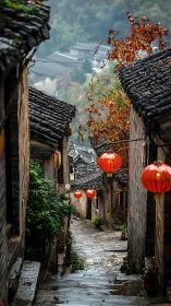Misty stone alleyway glows with red lanterns at dusk.