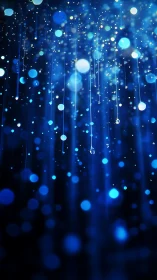 Glistening blue light trails descend through dreamy darkness.