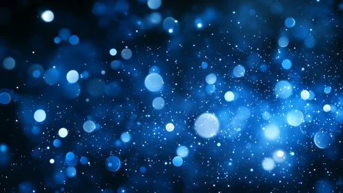 Blue bokeh light field with soft glowing particles backdrop.