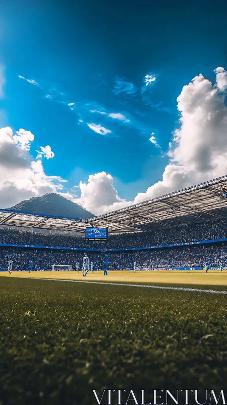 Panoramic football stadium under cumulus sky with match in play