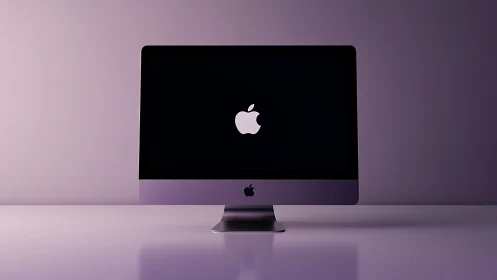 Sleek desktop computer glows in soft purple studio light.