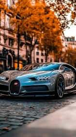 Silver hypercar prowls autumn city streets in fiery glow.