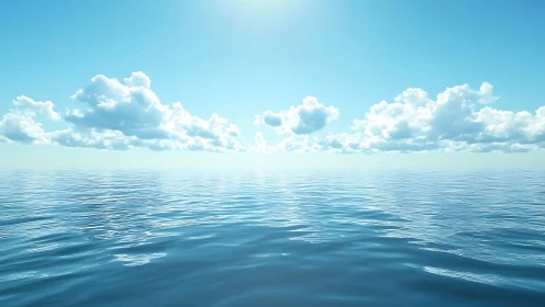 Calm blue ocean horizon under bright sky and clouds.
